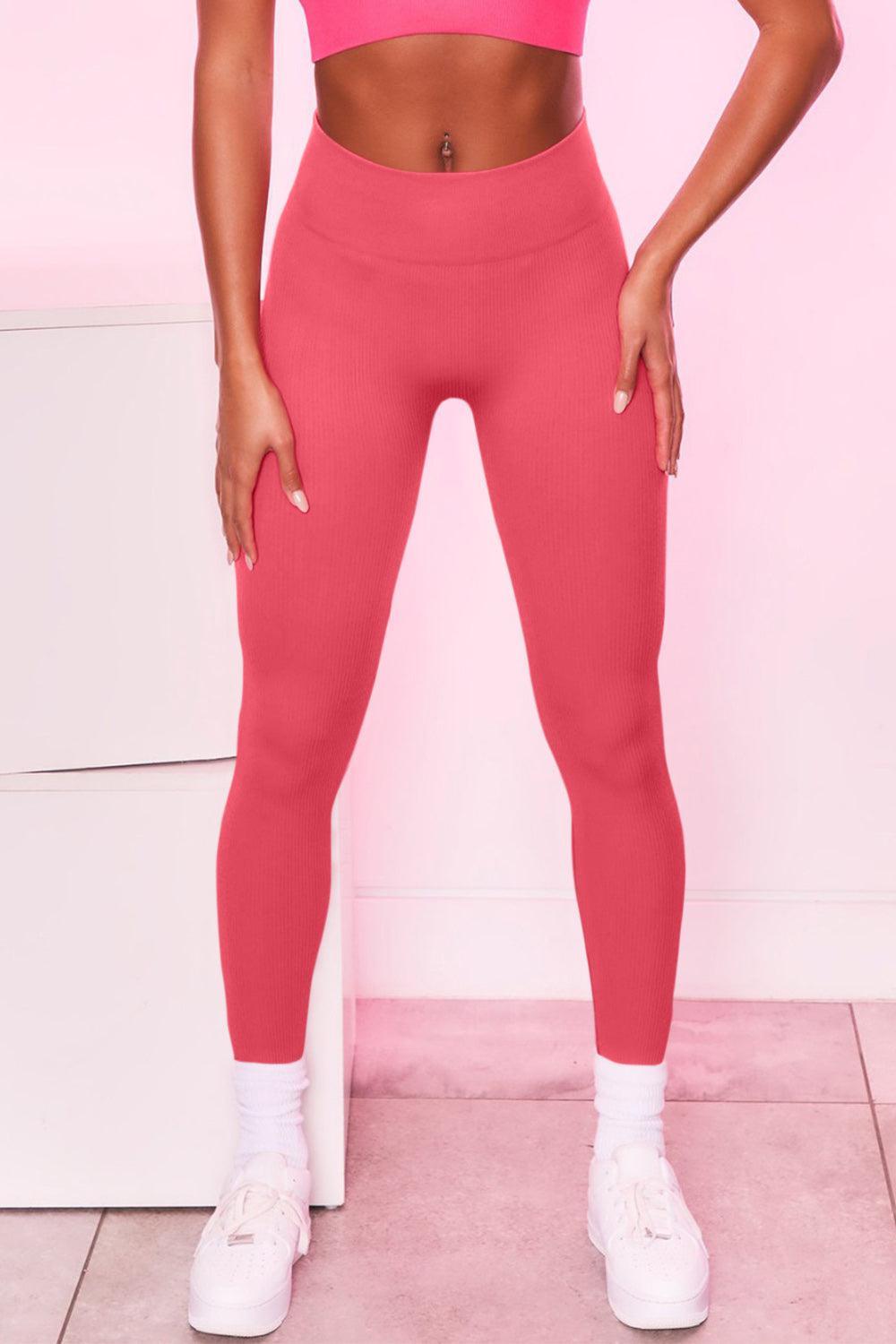 a woman in a pink sports bra top and pink leggings