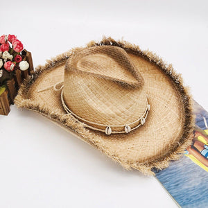 a straw hat sitting on top of a book
