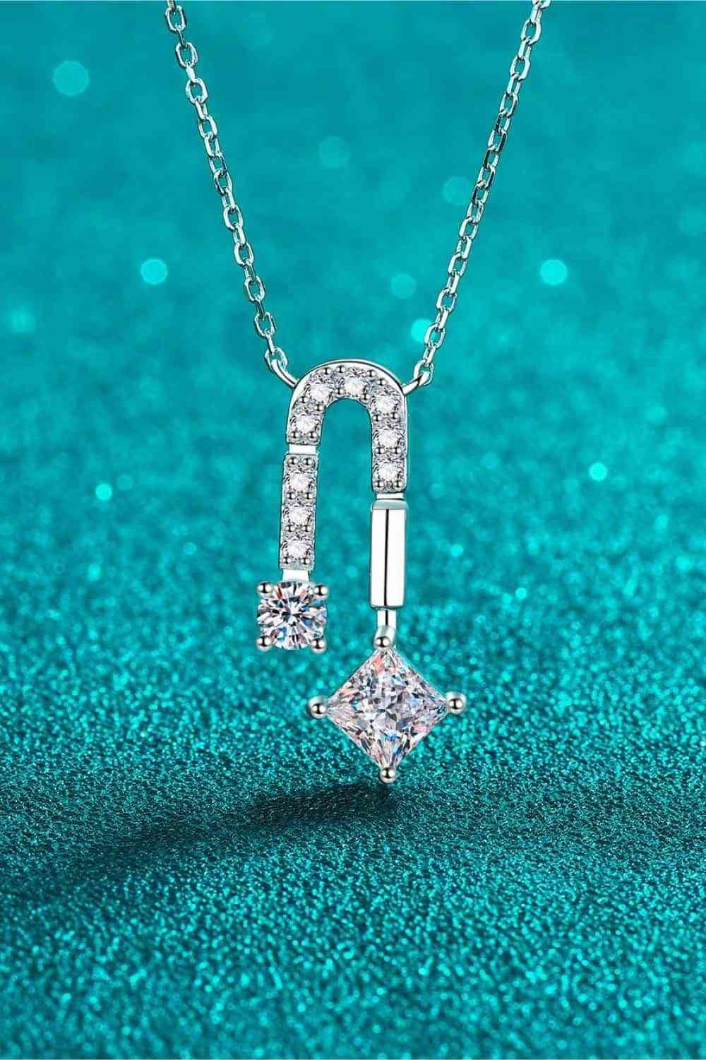 a diamond pendant on a chain