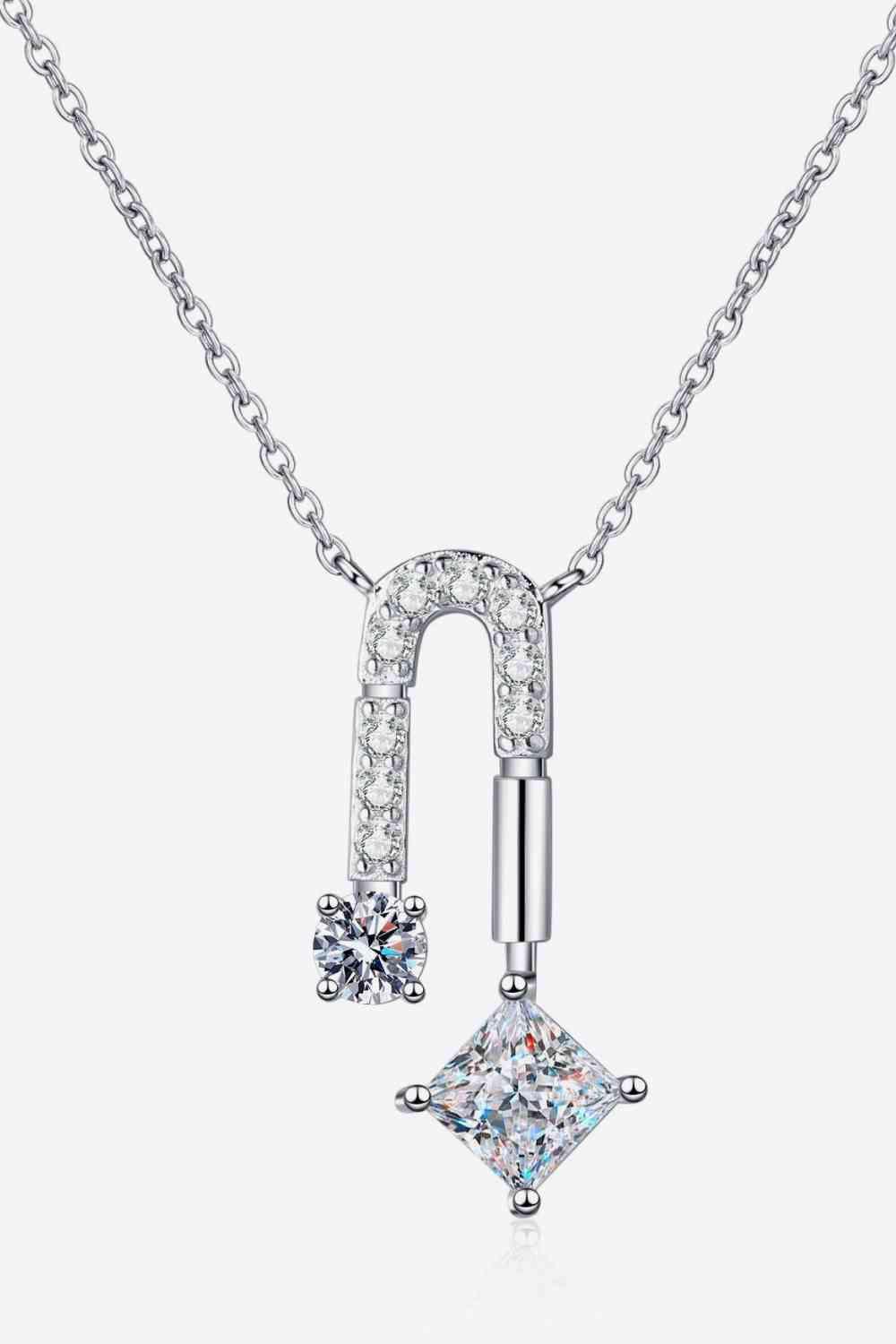 a necklace with a pendant and a diamond