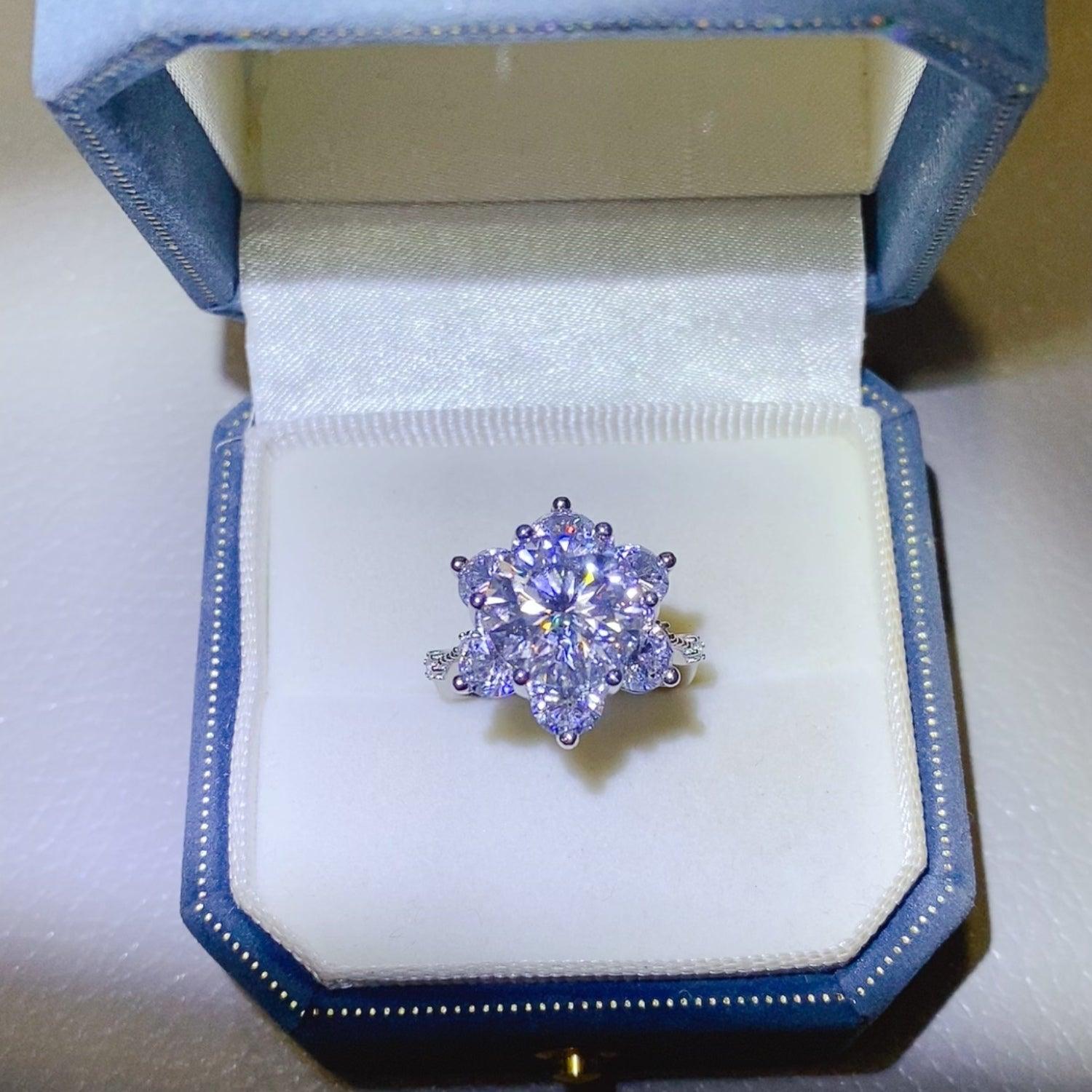 a diamond ring in a box on a table