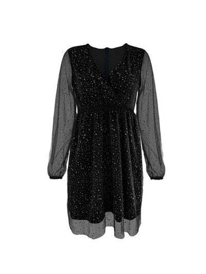 a black dress with sheer sleeves and polka dots