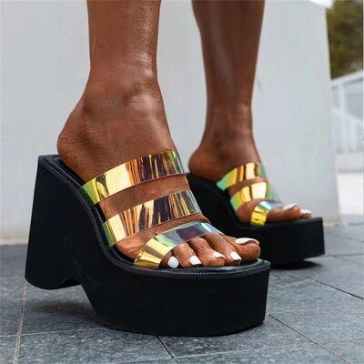 a close up of a person wearing a pair of platform sandals