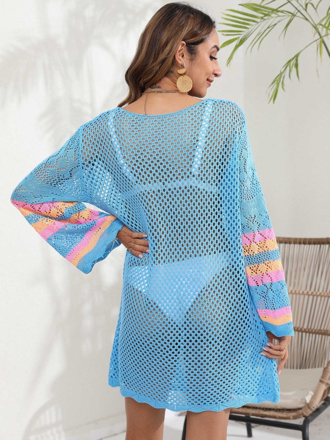 a woman wearing a blue crochet cover up