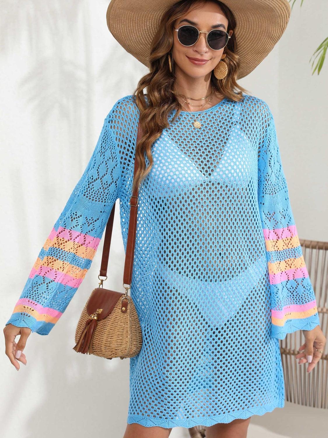 a woman wearing a blue crochet dress and hat