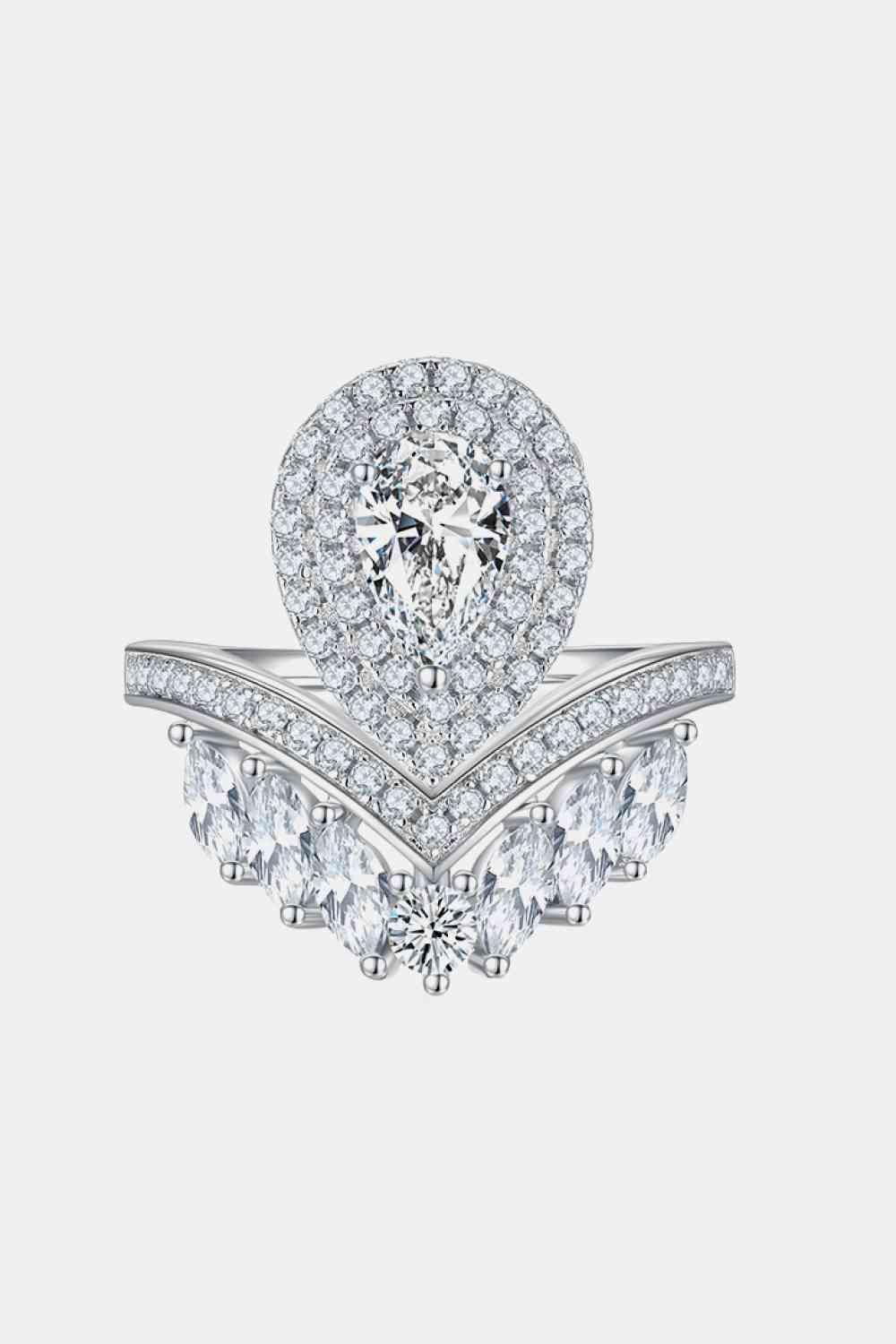 a ring with a pear shaped diamond surrounded by smaller pear shaped diamonds