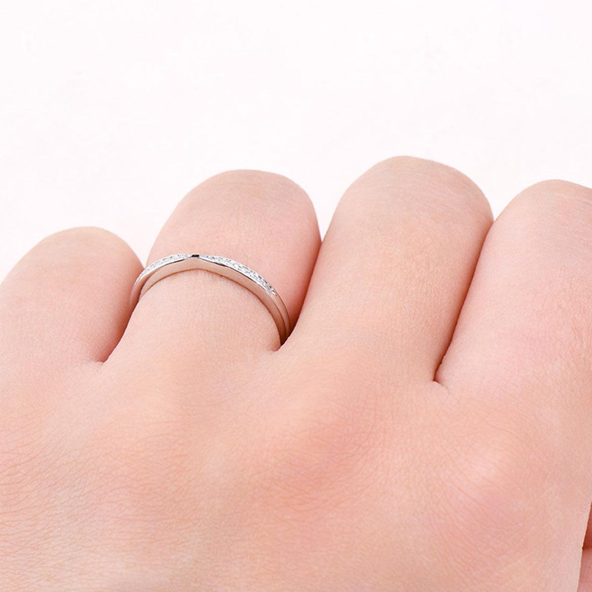 a person's hand with a ring on it