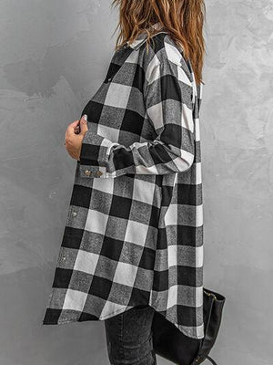 a woman wearing a black and white checkered shirt