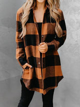 a woman wearing a brown and black plaid shirt