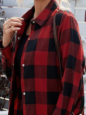 a woman wearing a red and black checkered shirt