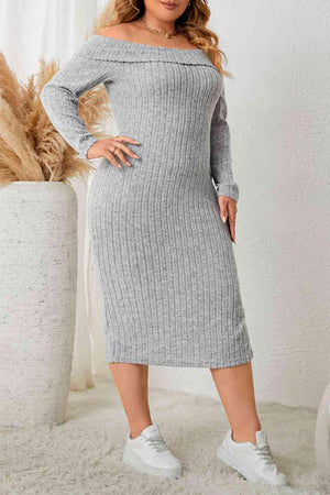 a woman in a grey sweater dress