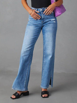 a woman in a black top and blue jeans