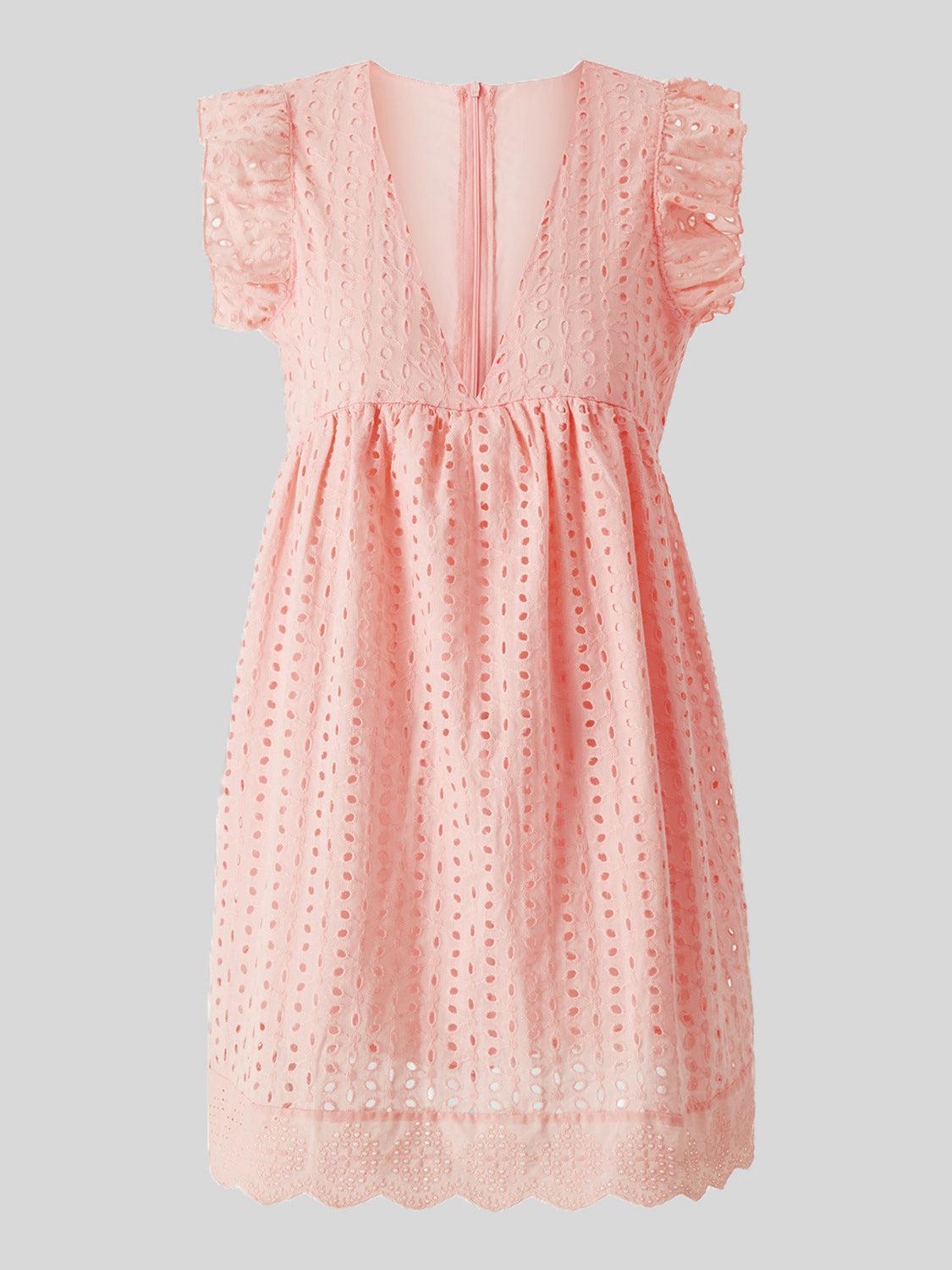 a little girl's pink dress with ruffled sleeves