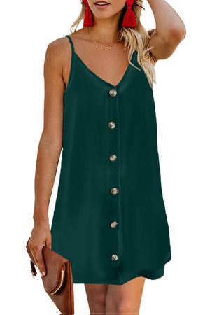 a woman wearing a green dress with buttons