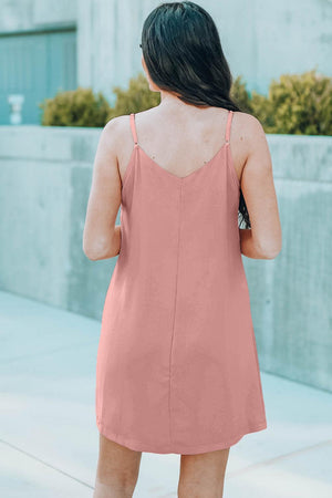 the back of a woman wearing a pink dress