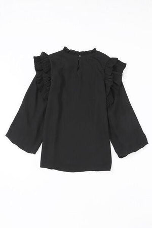 a black top with ruffled sleeves on a white background