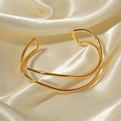 a close up of a gold ring on a white cloth