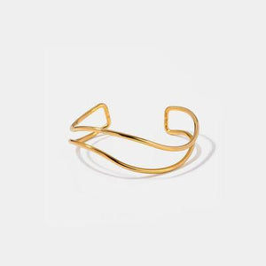 a gold ring on a white background