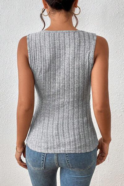 a woman in jeans and a sweater back view
