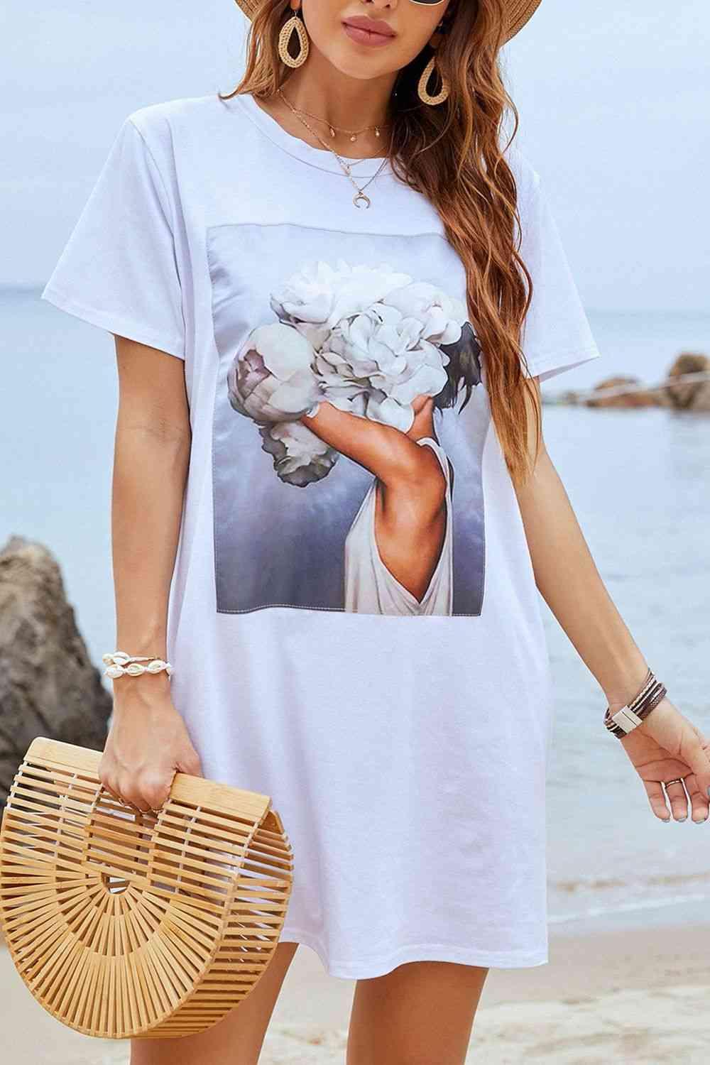 a woman wearing a white t - shirt with a picture of a woman holding flowers