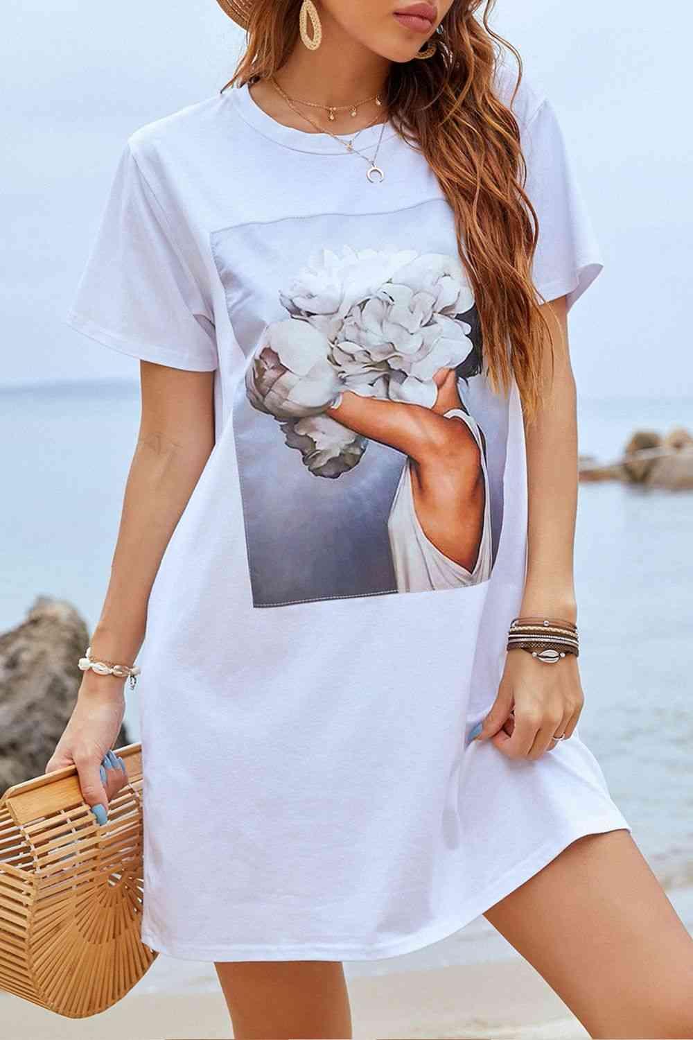 a woman wearing a white t - shirt with a picture of a woman holding flowers