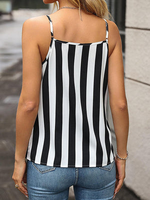 a woman wearing a black and white striped top