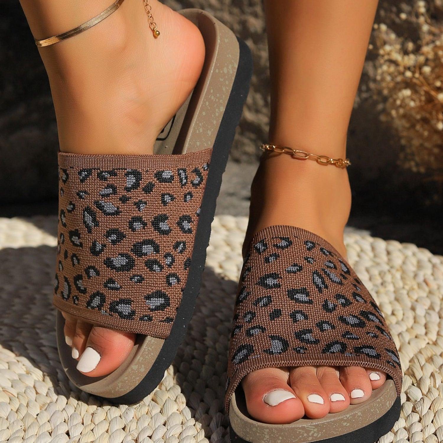 a close up of a person's feet wearing sandals