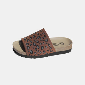 a women's slipper with a leopard print