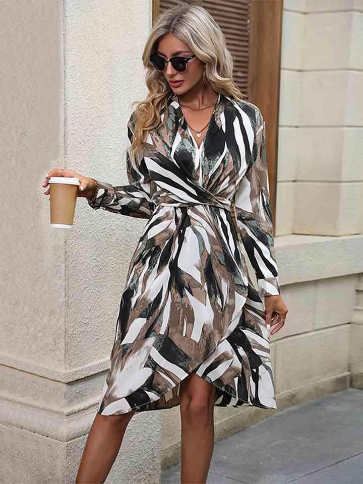 a woman in a dress holding a cup of coffee