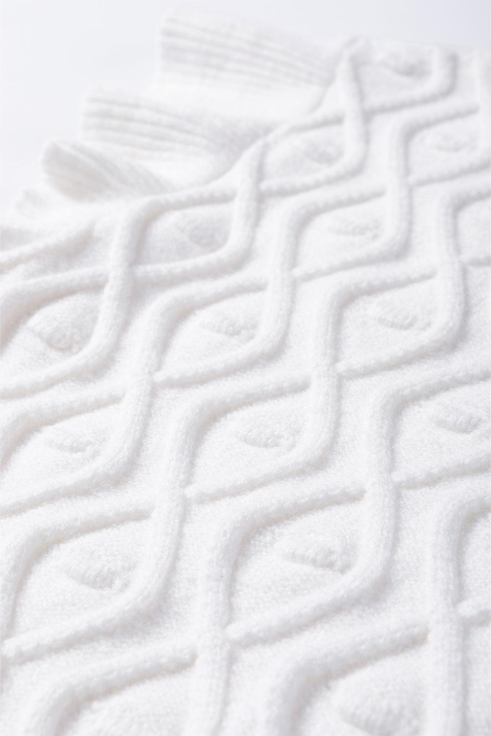 a close up of a towel on a white surface