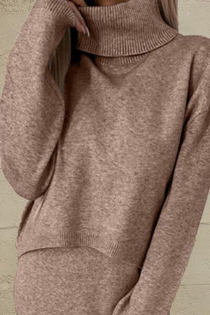 a woman wearing a brown turtle neck sweater
