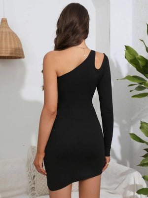 a woman in a black dress is looking back