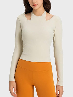 a woman wearing a white top and orange pants