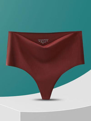 a woman's panties on a pedestal with a teal background