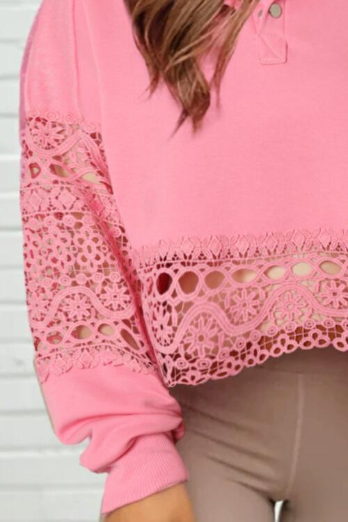 a woman wearing a pink top with lace detailing