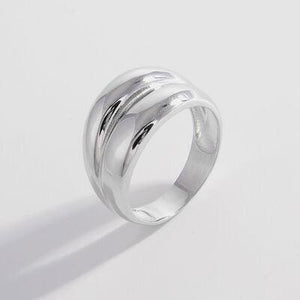 a silver ring on a white background