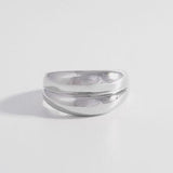 a couple of rings sitting on top of a white table