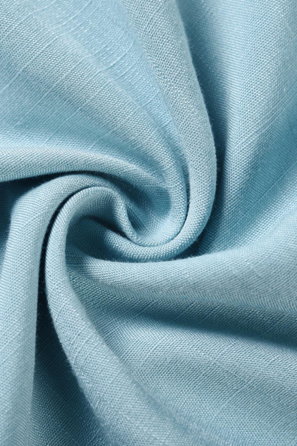 a close up of a light blue fabric