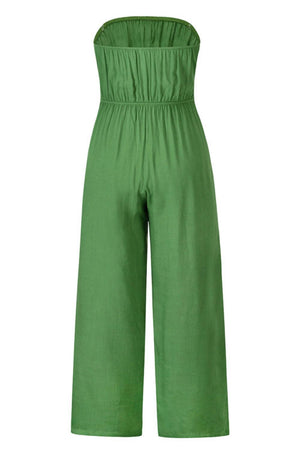 a woman wearing a green jumpsuit