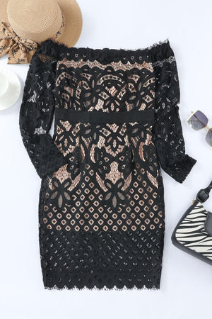 a black lace dress with a hat and sunglasses