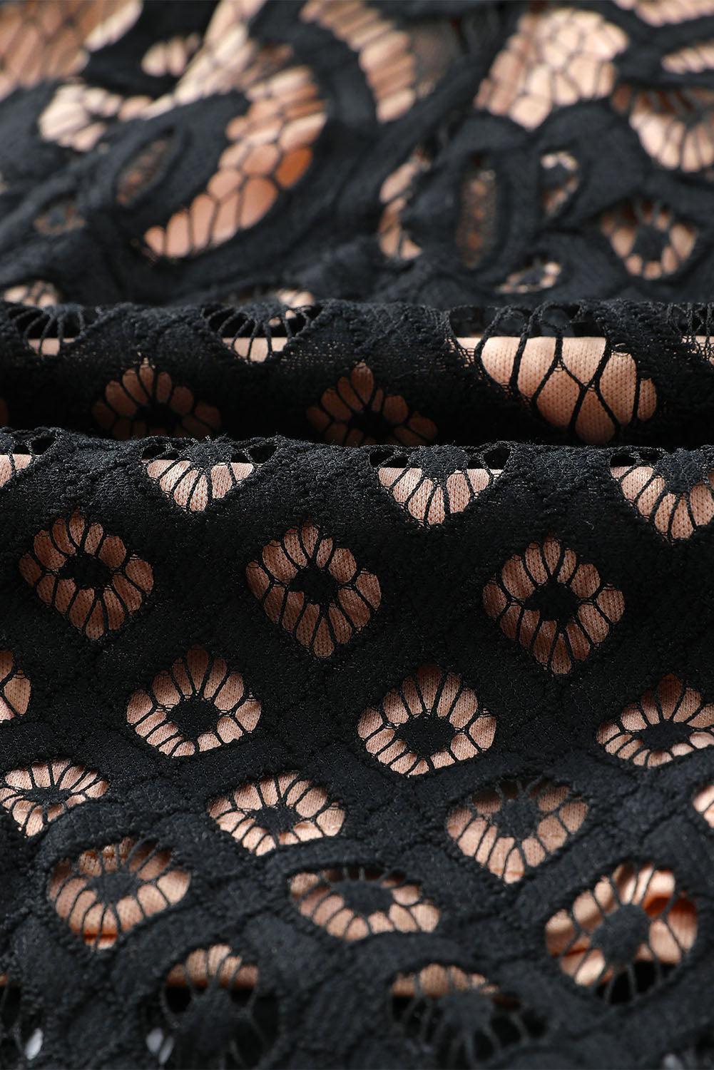 a close up of a black lace material