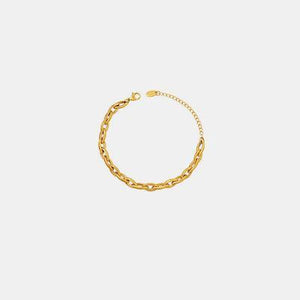 a gold chain bracelet on a white background