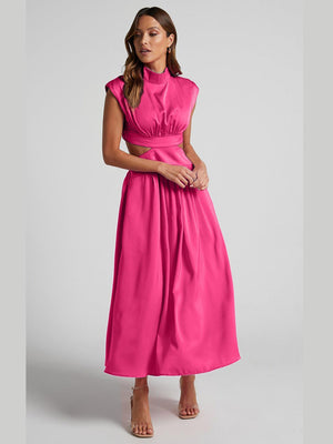 a woman in a bright pink dress