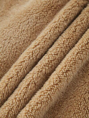 a close up of a tan colored blanket