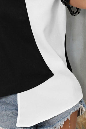 a woman is wearing a black and white top