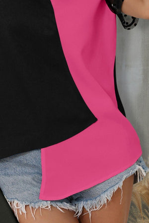 a woman wearing a pink and black top