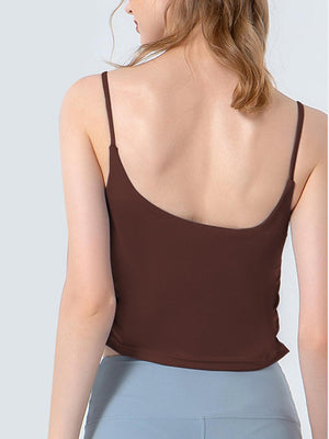 a woman wearing a brown tank top