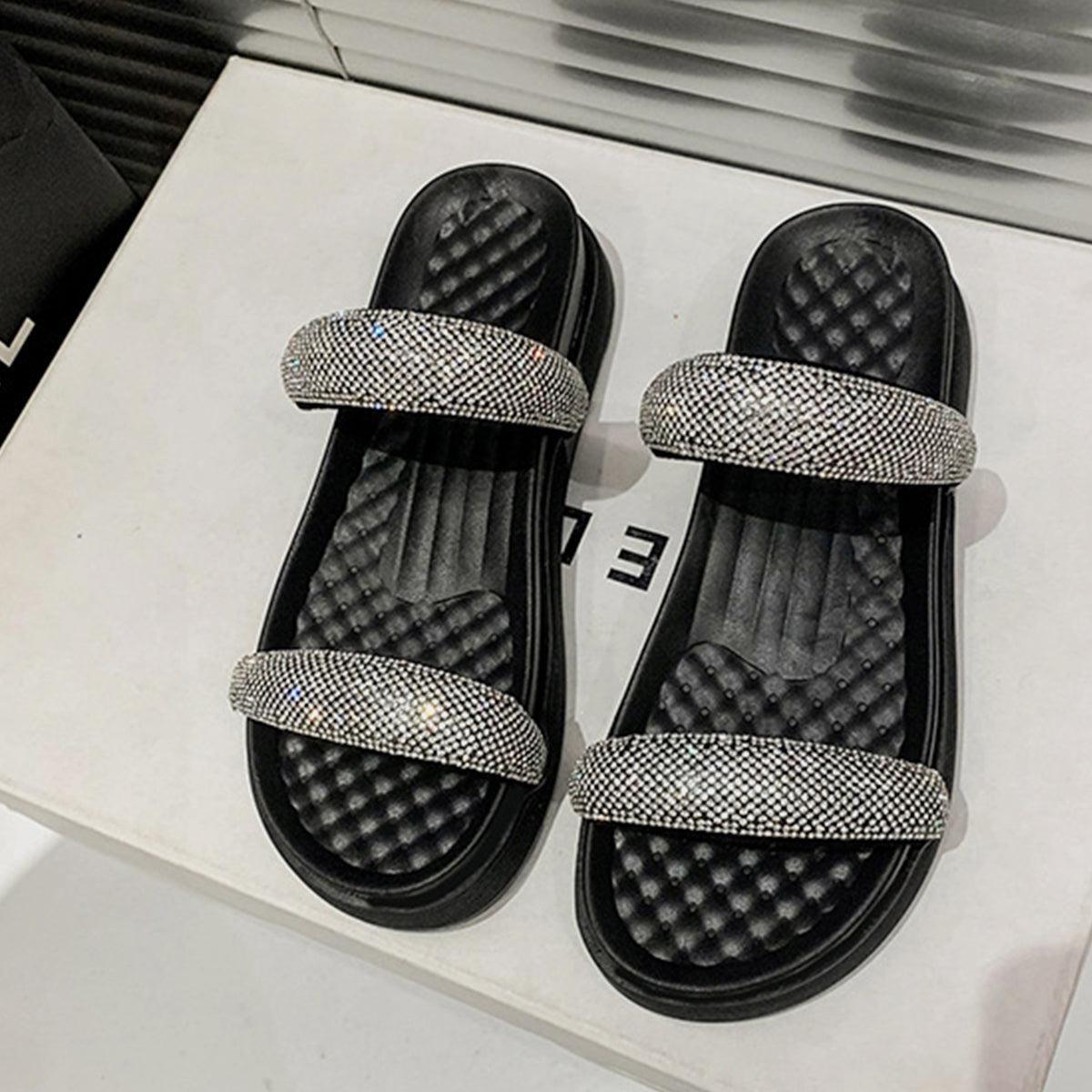 a pair of black and white sandals on display
