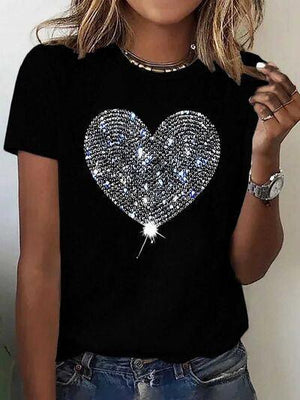 a woman wearing a black shirt with a heart on it