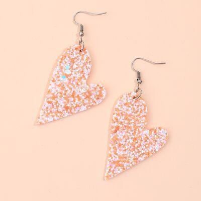a pair of pink and white glitter heart shaped earrings